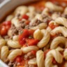 Bowl of hearty mac soup with ground beef, macaroni, and tomatoes.
