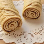 Delicious homemade nutroll with walnuts and dough from Country Cottage Bake Shop.
